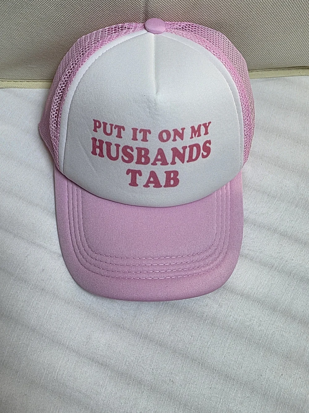 0908 Put It On My Husband's Tab Pink Trucker Hat